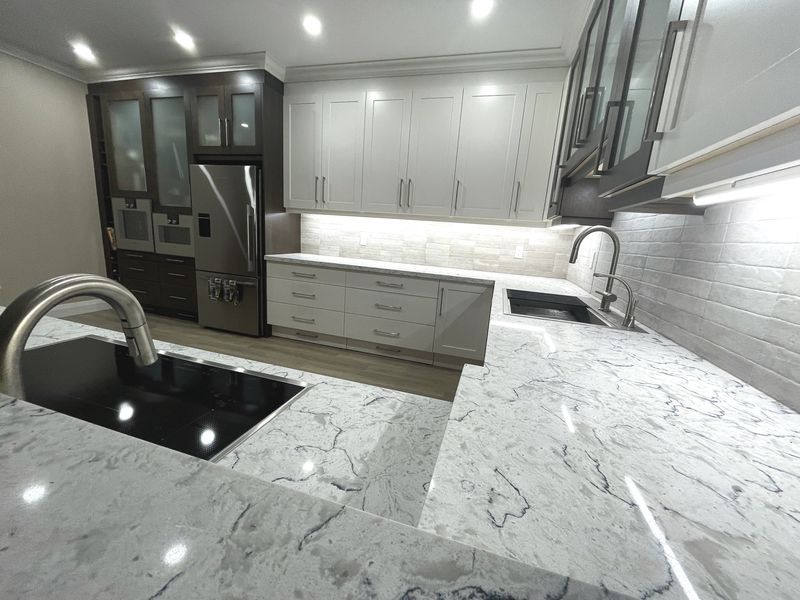 Close detail of a honed marble countertop and undermount sink